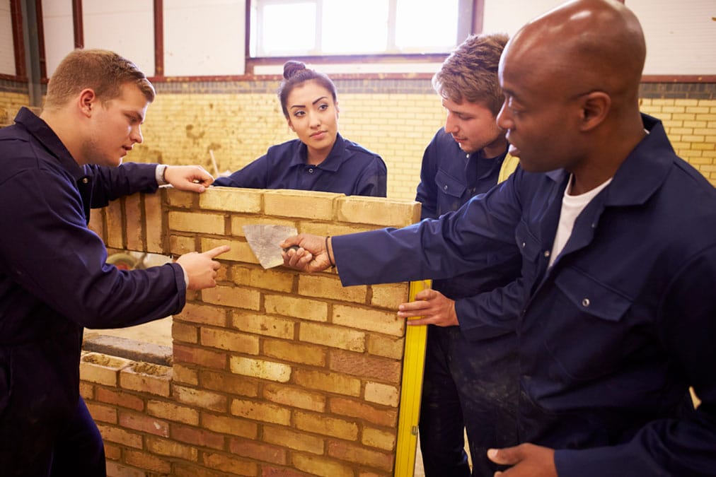 construction students learning about bricklaying